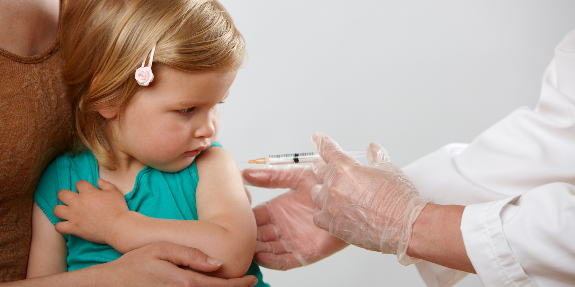 Little girl having an injection
