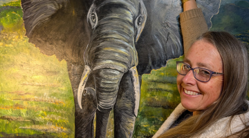 Artist Sue Hodge pictured with one of the African themed artworks that will be showcased in her upcoming exhibition.