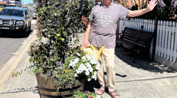 Tommy Jeffs busy planting the flowers on Gaskill Street.